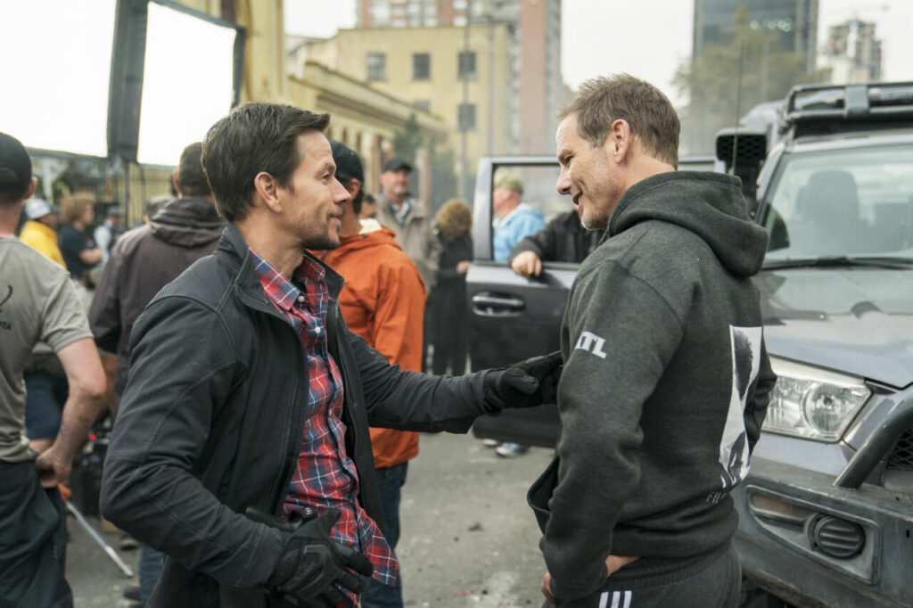 Mark Wahlberg and Director Peter Berg behind the scenes on the set of MILE 22.